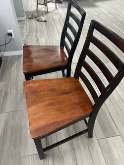 Two solid wood chairs