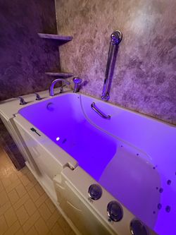 Wheelchair accessible walk in tub
