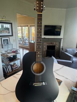 Matte black acoustic Dreadnaught guitar