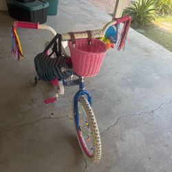 20” Bike for ages 5-12 years, include helmet size M and accesorios It's almost new; it was only used once.