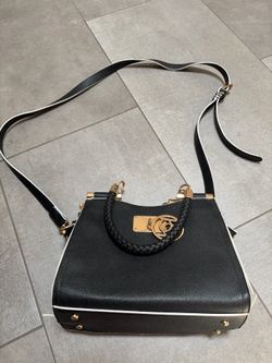 Black handbag with gold accents.