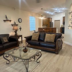 2 leather Couches with table