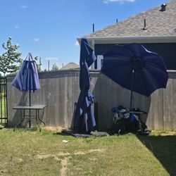 Umbrellas and table set with 8 chairs
