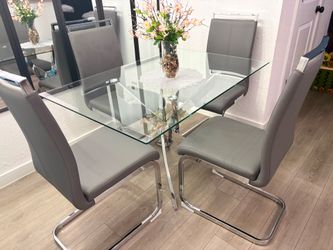 Elegant Dining Table Four Gray Chairs