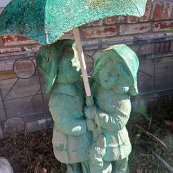Boy And Girl  With Dog Under Umbrella Statue + Fountain