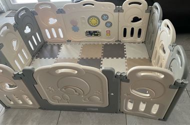 Playpen with 12 panels and some floor mats