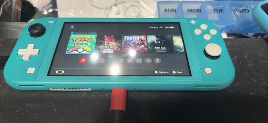 Nintendo switch lite and a 256 gb sd card
