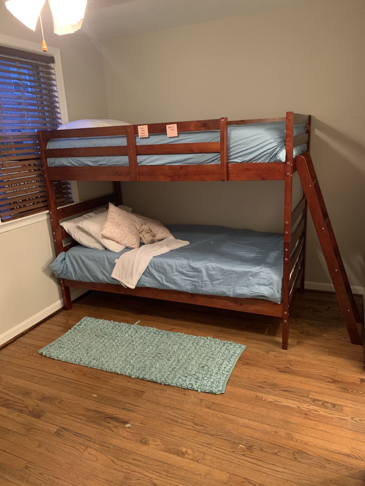 Bunk bed set with mattresses and bedding