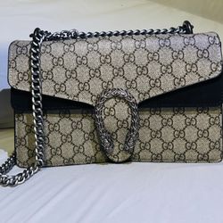 Dinoysus Woman’s Gucci Bag