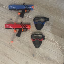 Two Rival Nerf Guns With Matching Headgear 