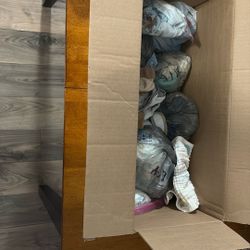 Whole Box Of Baby Clothes Each Wrapped With A Few Diapers 