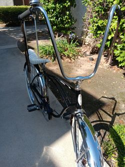 SCHWINN CRUISER  ALL BLACK ORIGINAL PAINT, RIMS,.MADE IN CHICAGO  USA.HAS NEW FENDERS,TALK BARS ,BANANNA  SEAT, SISSY BAR, SLIME TUBES.GREAT SUMMER CR