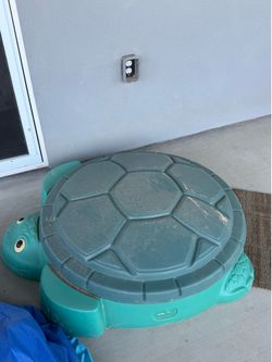 Sand pit with sand and extra bag of dirt