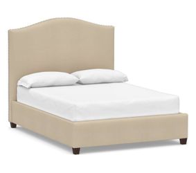 Raleigh Curved Upholstered Bed with Pewter Nailheads California King Twill Parchment