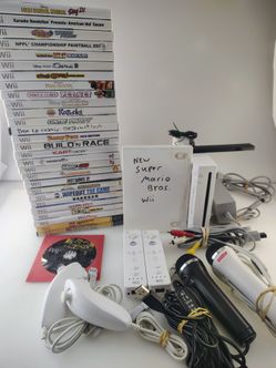 Nintendo Wii Bundle with 30 games & 2 Microphones