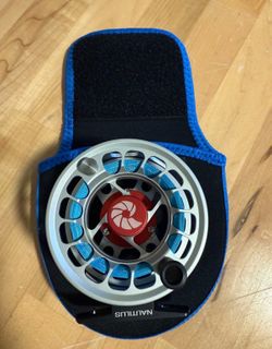 NEW UNUSED NAUTILUS XM FLY FISHING REEL (SILVER)