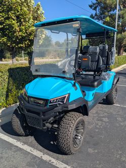 4 Forward Electric Golf cart lifted with power steering.