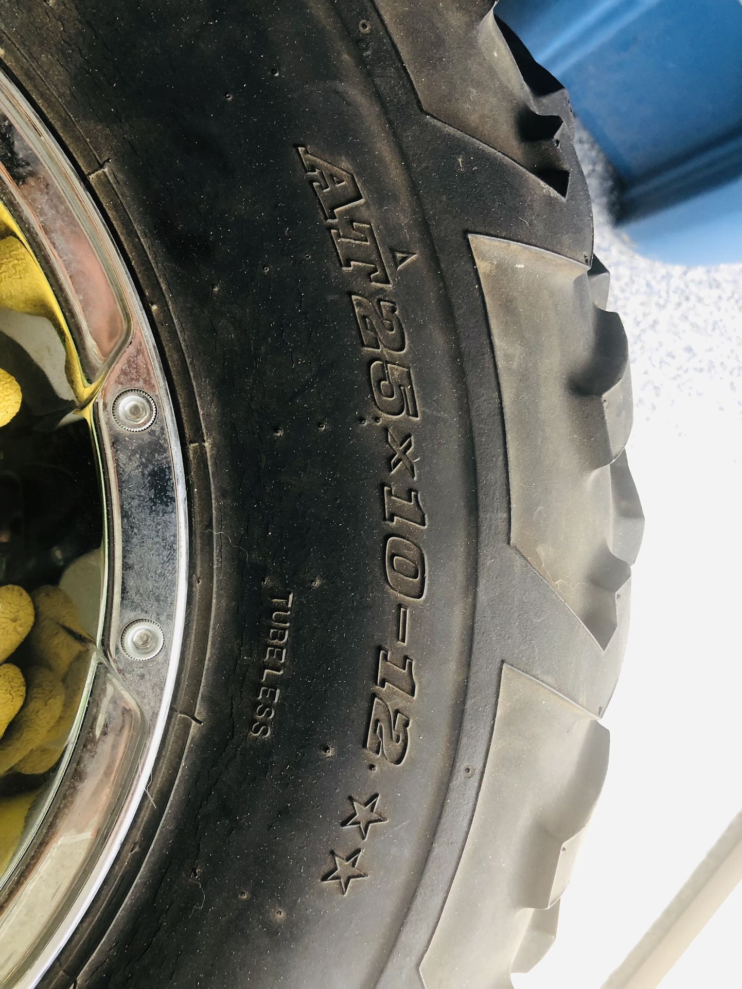 Four AT25X10-12 tub-less Tires.