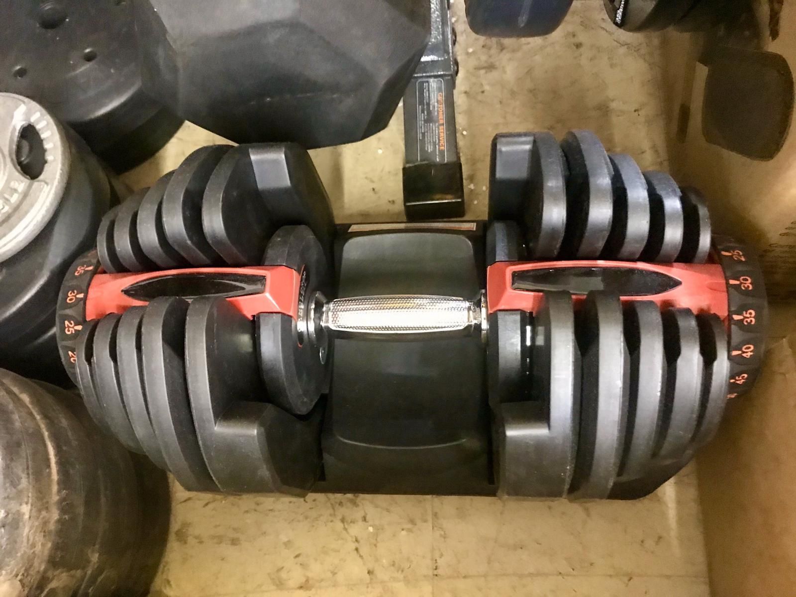 One Brand New Adjustable Dumbbell. 10 to 90 lbs.