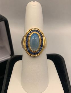 Custom Made 18K Gold Moonstone and Sapphire Ring Asking $2,500 Serious buyers only. This one of a kind custom made 18K yellow gold ring features a