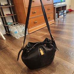 Tignanello black leather drawstring bag , medium size, 11"×10"×3", clean and good condition