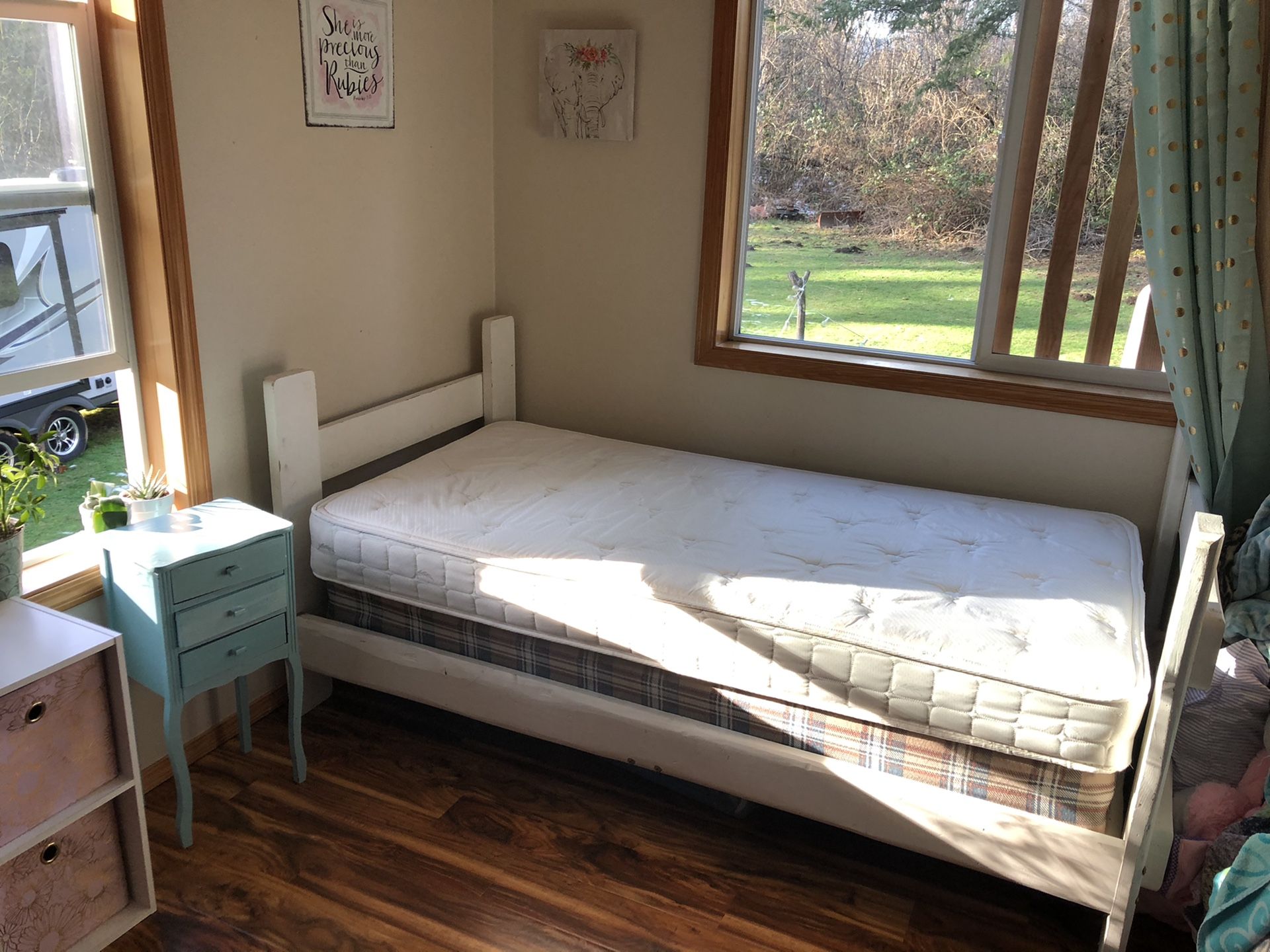 Very basic twin bed with wood frame