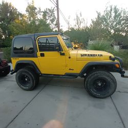 JEEP TJ HARDTOP $1000, FACTORY DOORS, RIGHT SIDE DAMAGED $400,  GREAT TIRES AND RIMS $300, BACK SEAT $200, PASSENGER9 SEAT $125., REST  OF JEEP $3800 