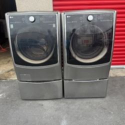 LG GRAPHITE GREY STEAM SMART JUMBO FRONT LOAD WASHER AND GAS DRYER SET WITH SIDEKICK PEDESTAL 