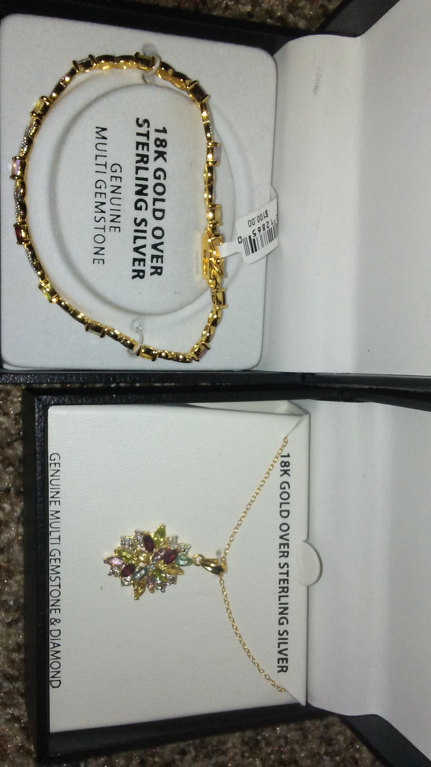 Brand new!! Beautiful gold necklace and matching gold bracelet!! Gemstones are genuine and each items has a $100 price tag on the box!