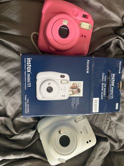 Pink instax mini 9 and white instax mini 11