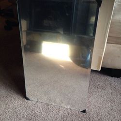 Recessed mirrored medicine cabinet