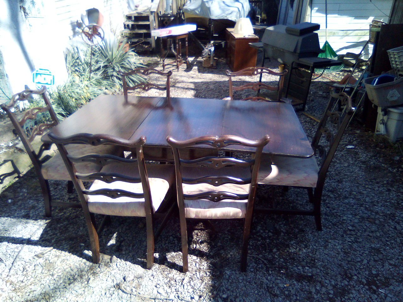 Duncan Hines table and made in the early fifties got the brass claw Ann's on the leg nice antique table with 6 matching chairs$350chairs six chairs
