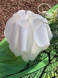 Hand folded shades hanging light source