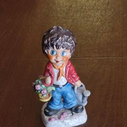 Vintage Goebel figurine Gardener Children of Paris series by Michel Thomas.
Produced in West Germany around 1977 and features a boy with large blue 
e