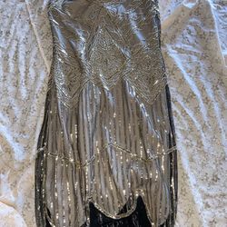 sequined flapper dress, a style iconic of the 1920s. 