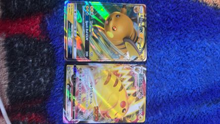 1 regular raichu gx. and 1 japanese pikachu Vmax
