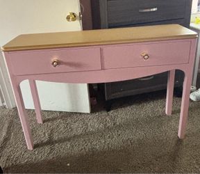 Pink console table with drawers
