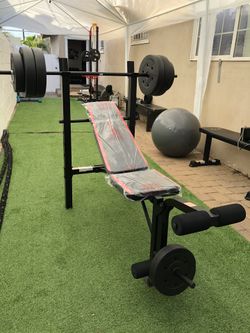 Gym Equipment Adjustable Bench press, barbell, leg developer and 100lbs of weight