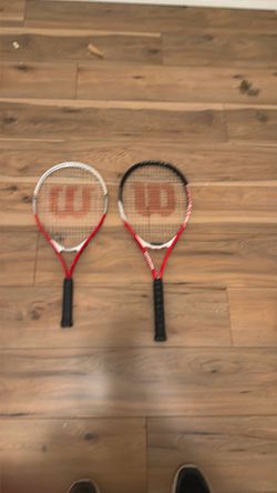 Pair titanium wilson tennis rackets
