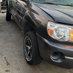 Parts Truck, 2010 Toyota Tacoma four cylinder five speed transmission, rear driver side, damage, differential no Good parts