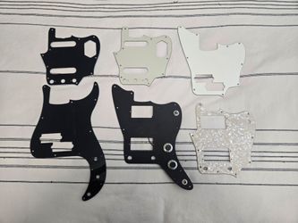 Lot of Jazzmaster, Jaguar, and P Bass pickguards