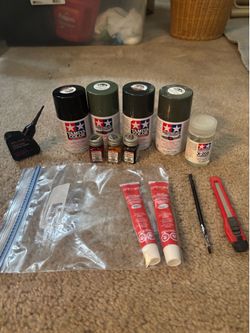 Model glue, paint thinner and razor ( partially used)