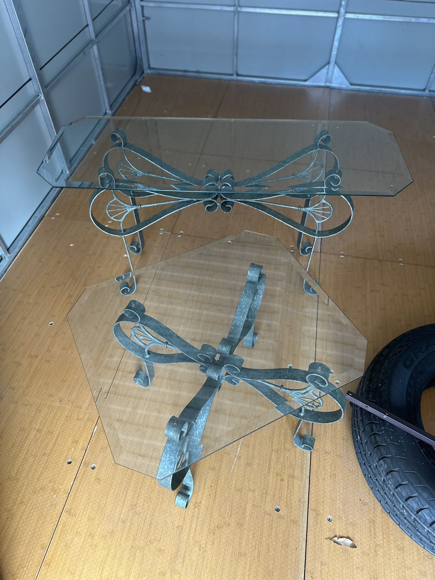 2  peice matchimg glass OUTDOOR table set Inside Or Outside . excellent condition Glass big H26”x15x18. SmallH21x18x24”