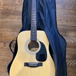 SUZUKI ACOUSTIC GUITAR. used, in original bag  in great condition