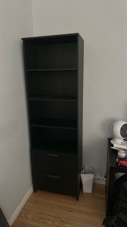 Black bookshelf with drawers