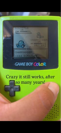 Gameboy color with blue Pokémon cartridge