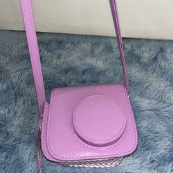 purple Polaroid camera  
