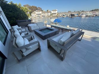 Multiple pieces of solid teak patio furniture