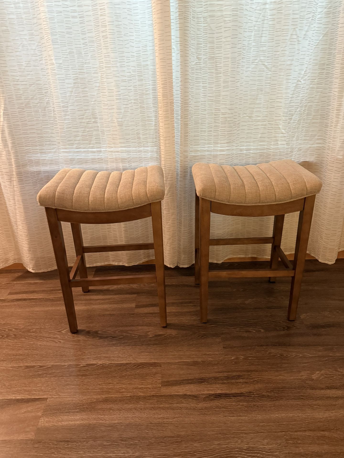Two Tan Counter Stools