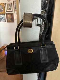 Coach black barrel bag